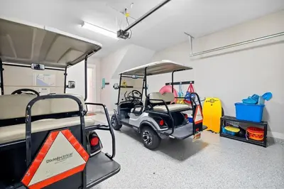 a golf cart is parked in a room at Surfers Retreat in Inlet Beach