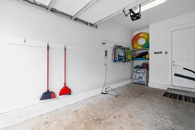 a room with two broomsticks on the wall of a room at Just Add Water in Inlet Beach