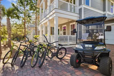 a group of bikes parked in front of a house at Selah by the Sea in Inlet Beach