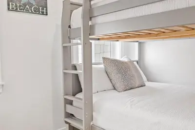 a bunk bed in a small room with a bunk bed gmaxwell gmaxwell gmaxwell at Suits Us in Inlet Beach