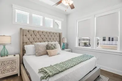 a white bedroom with a large bed and windows at No Worries, Beach Happy in Inlet Beach