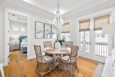 a dining room with a table and chairs at Lovely Day on 30A in Inlet Beach