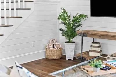 a room with a table with a potted plant at It's a Shore Thing in Inlet Beach