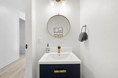 a bathroom with a sink and a mirror at A Lovely Stay on 30A in Seacrest