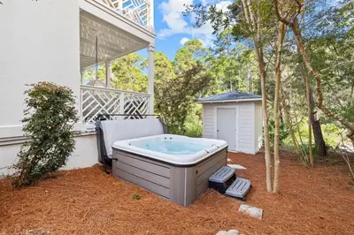 a hot tub in the yard of a house at A Lovely Stay on 30A in Seacrest