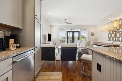 a kitchen with white cabinets and a counter top at Resting Beach Place in Inlet Beach