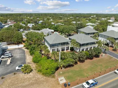 an aerial view of a house with a parking lot at Resting Beach Place in Inlet Beach
