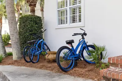two blue bikes parked next to a house at Resting Beach Place in Inlet Beach
