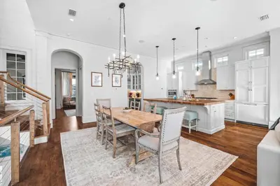 a kitchen and dining room with a table and chairs at Sadie's Cottage in Rosemary Beach