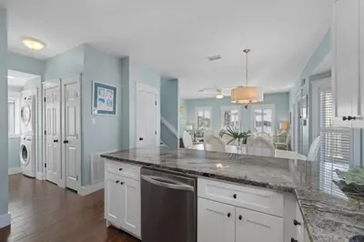a kitchen with blue walls and a counter top at Seahorse Landing in Seagrove Beach