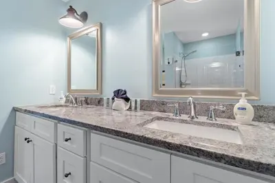 a bathroom with a sink and a mirror at Seahorse Landing in Seagrove Beach
