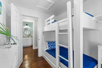 a white bunk bed in a white room at Seahorse Landing in Seagrove Beach