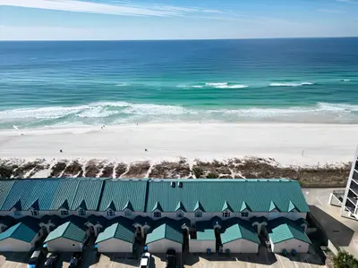 a view of the beach from the balcony of a resort at Gulfs Edge Townhome #7- Sun-Kissed Memories by Emerald Coast Retreats in Panama City Beach