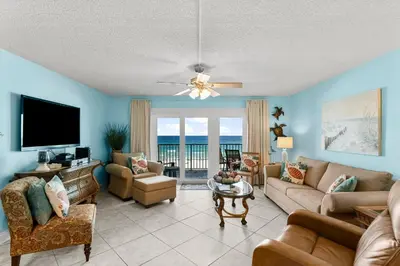 a living room with a couch and a tv at Mariner West #403 in Panama City Beach