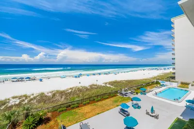 a view of the beach from the balcony of a resort at Mariner West #403 in Panama City Beach