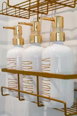 three bottles of soap on a shelf in a bathroom at 3Zs Beach House 30A Sleeps 10! in Inlet Beach