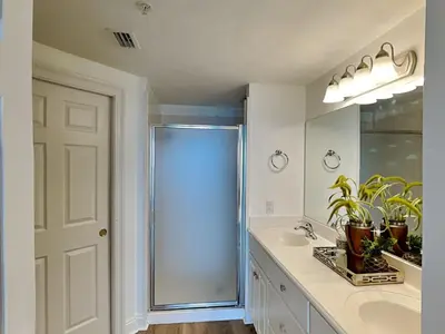 a bathroom with a shower and a sink at Treasure Island #1707 in Panama City Beach
