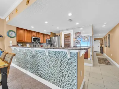 a kitchen with a blue tile counter top at Palazzo 1405 by Emerald Coast Retreats in Panama City Beach