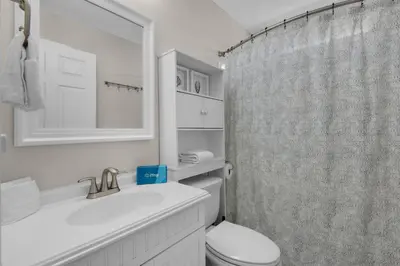 a bathroom with a sink and a toilet and a shower at Pier Atlas (3/2) in Panama City Beach