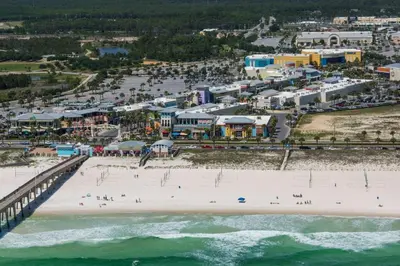 an aerial view of a beach with a pier at Pier Atlas (3/2) in Panama City Beach