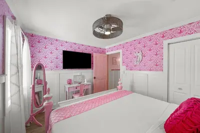 a pink bedroom with a bed and a tv at Pink Prerogative Beach Bungalow with Private Pool in Panama City Beach