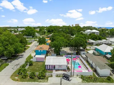 an aerial view of a park with a swimming pool at Pink Prerogative Beach Bungalow with Private Pool in Panama City Beach
