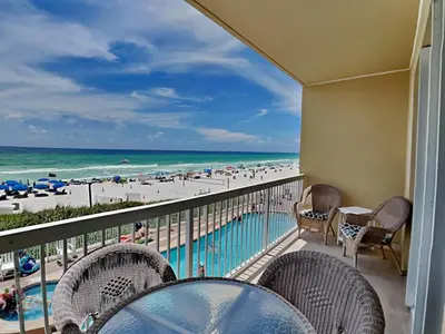 a balcony with chairs and a view of the beach at Seychelles #206 in Panama City Beach