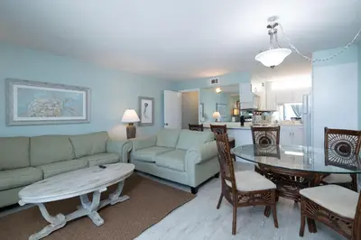 a living room with a couch and a table at 1BR Sleeps 5 at The Summit with Ocean Front Views in Panama City Beach