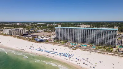 an aerial view of a beach with a hotel at Mariners Retreat - High Rise Beach Living in PCB in Panama City Beach