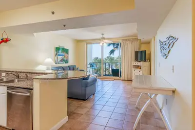 a kitchen and living room with a couch at Ocean View Escape - Beach Resort in Panama City Beach
