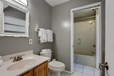 a bathroom with a sink and a toilet and a tub at Ocean View Retreat - Beachfront Bliss in Panama City Beach