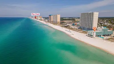 an aerial view of a beach with buildings and the ocean at Coral Cove Beachfront Condo for 3 with Onsite Pool in Panama City Beach