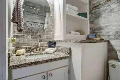 a bathroom with a sink and a toilet at Seaside Villa - Ocean View Studio in Panama City Beach