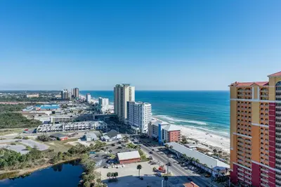 an aerial view of a city and the ocean at Sandy Feet Retreat - Ocean View Condo in Panama City Beach