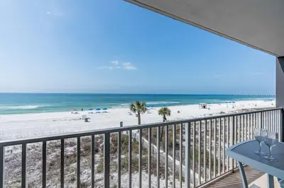 a balcony with a view of the beach at Beachfront Days Ocean View Condo Bliss in Panama City Beach