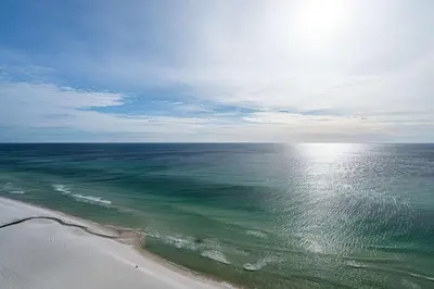 an aerial view of a beach with the ocean at Beachfront Haven 2 BDR Kid-Friendly Resort in Panama City Beach