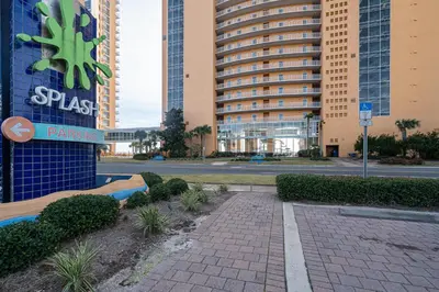 a brick walkway in front of a large building at Beachfront Haven 2 BDR Kid-Friendly Resort in Panama City Beach