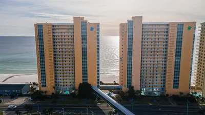 a group of tall buildings next to the ocean at Beachfront Haven 2 BDR Kid-Friendly Resort in Panama City Beach