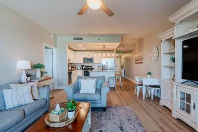 a living room with a couch and a table at Whitesands Retreat - Incredible Resort Home in Panama City Beach