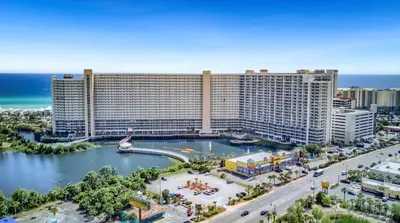 an aerial view of a large hotel with the ocean at Whitesands Retreat - Incredible Resort Home in Panama City Beach