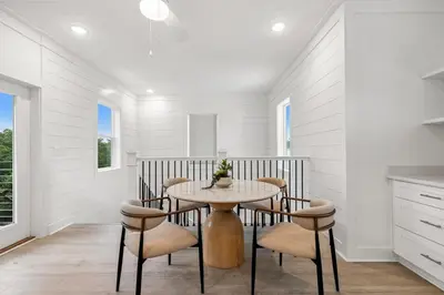 a dining room with a table and chairs at 224 W Willow Mist Rd in Inlet Beach