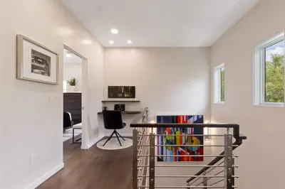 a room with a book shelf filled with books at New 30A Retreat Beach Access Hot Tub & Guest Suite in Seacrest