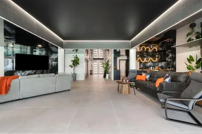 a large living room with couches and a tv at The Summit Penthouse 1501 in Panama City Beach