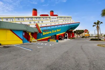 a large cruise ship parked in a parking lot at Shores of Panama #421 by Book That Condo in Panama City Beach