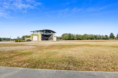 an empty field with a building in the background at Shores of Panama #421 by Book That Condo in Panama City Beach