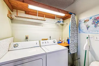 a laundry room with a washer and dryer at 17007 Firenzo Ave home in Panama City Beach