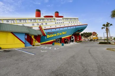 a large cruise ship parked in a parking lot at 17007 Firenzo Ave home in Panama City Beach