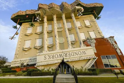 a building with a sign that reads santomime cincinnati at 17007 Firenzo Ave home in Panama City Beach