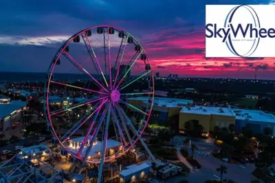 a ferris wheel at an amusement park at night at Luxe Gulf Front View with Free Beach Chairs, Balcony, & Resort Amenities in Panama City Beach