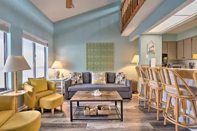 a living room with a couch and chairs and a table at Steps to the Beach PCB Condo with Balcony! in Panama City Beach